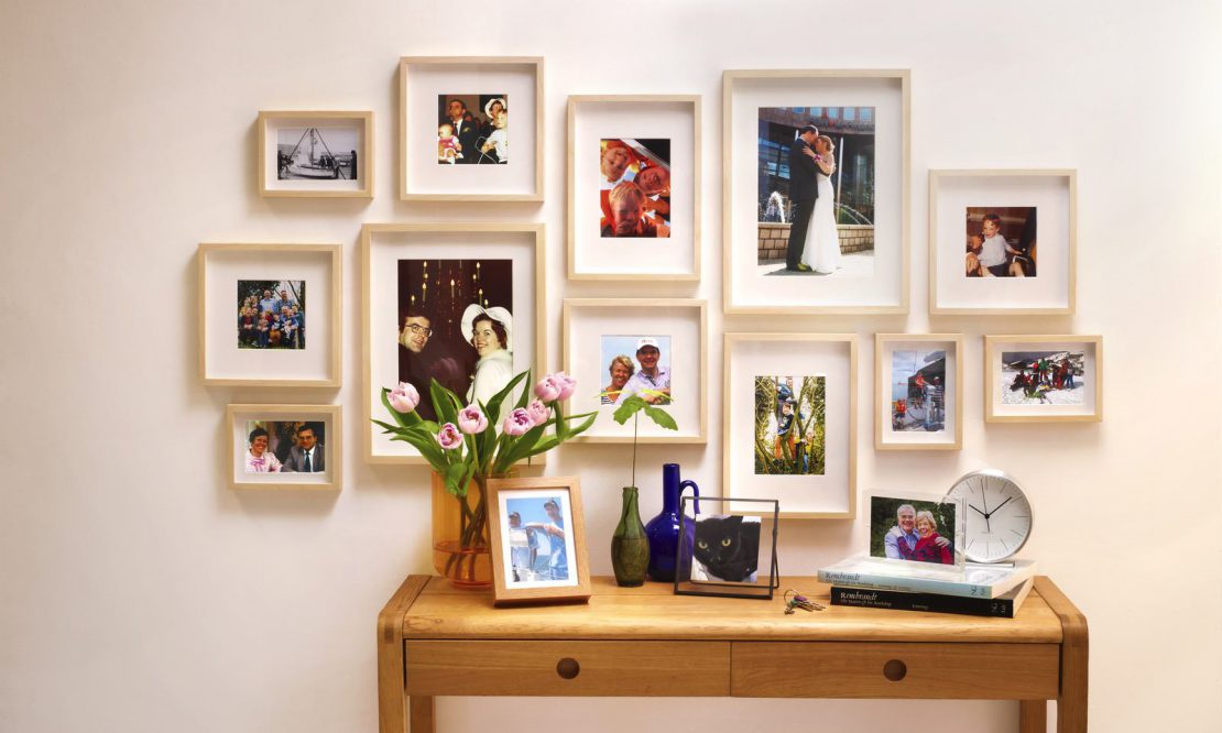 A display of family photographs in frames