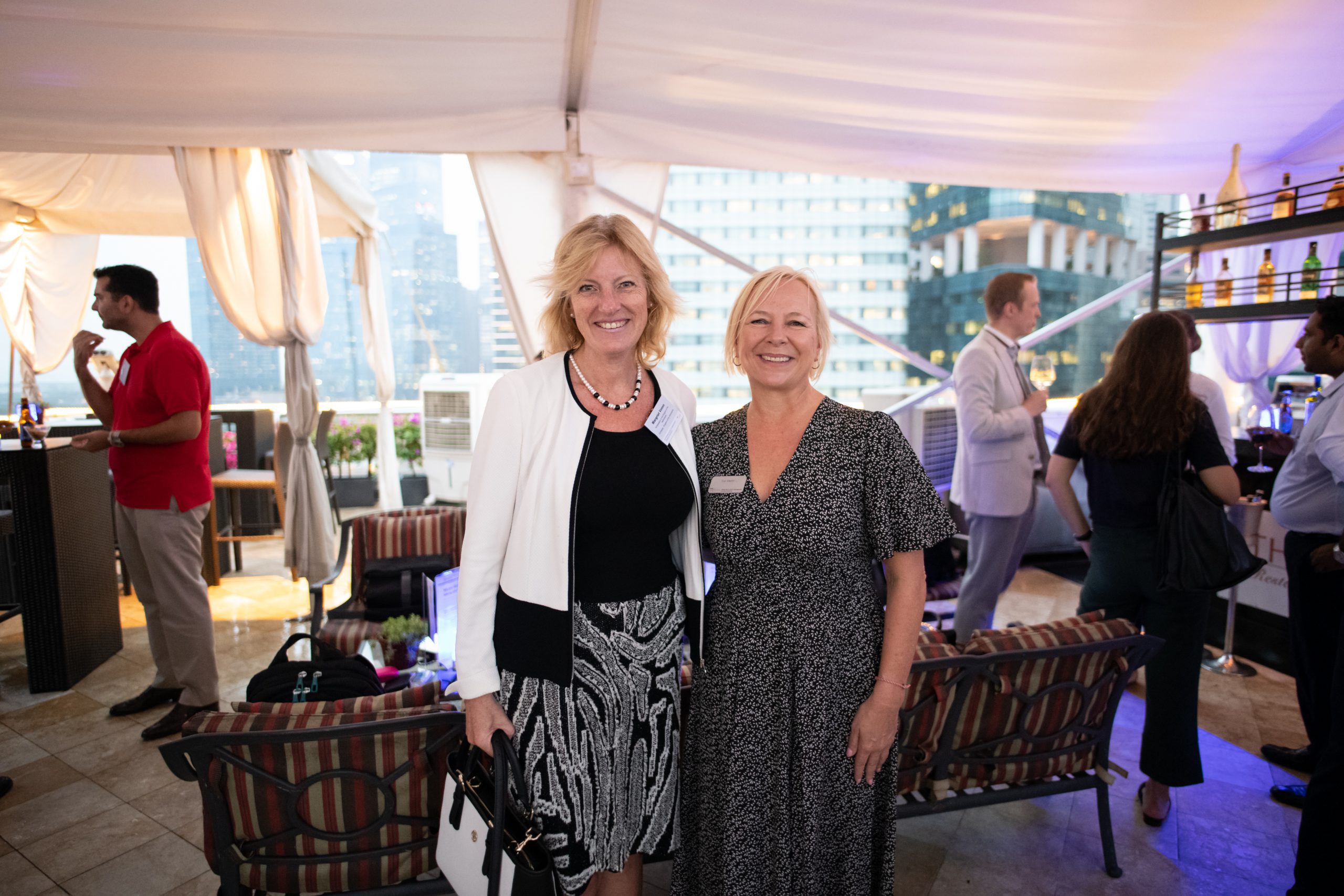 Margriet and Sue standing together at an event